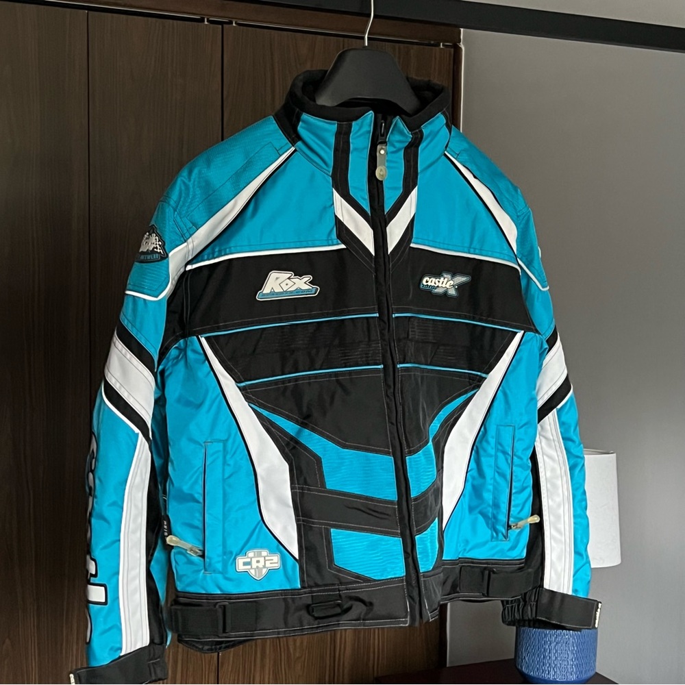 Women’s size medium blue white and black Castle X snowmobiling jacket